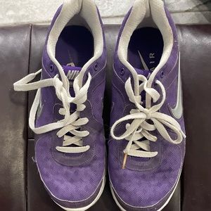 Purple Nike air tennis shoes.